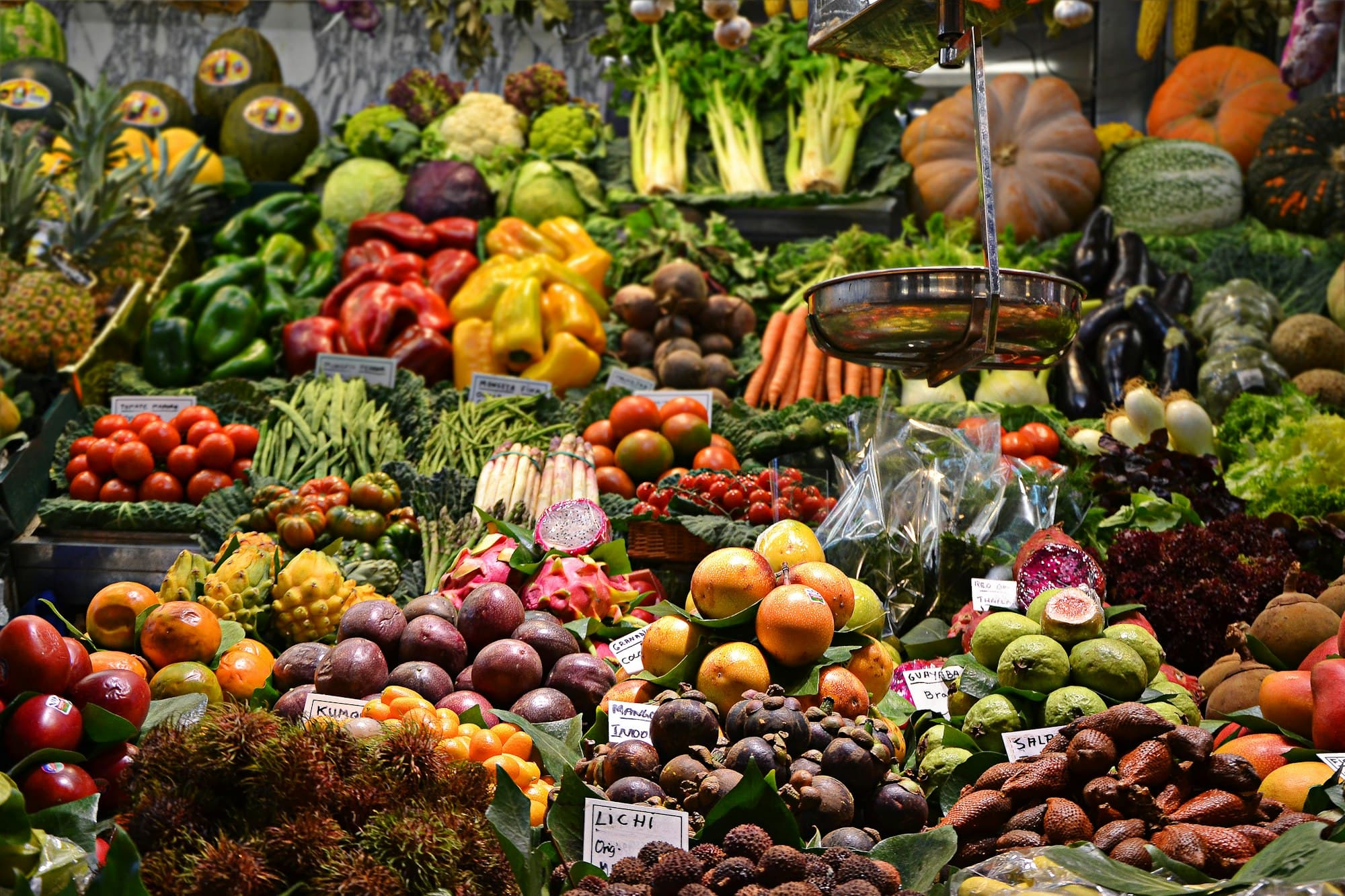 Piles of market vegetables and fruit